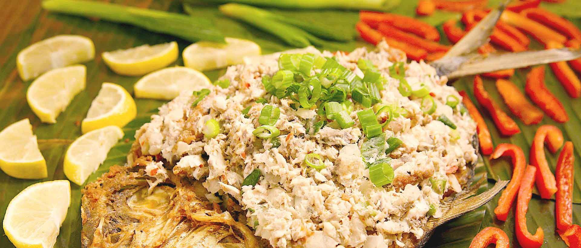 Bangus sisig made with flaked milkfish, served sizzling