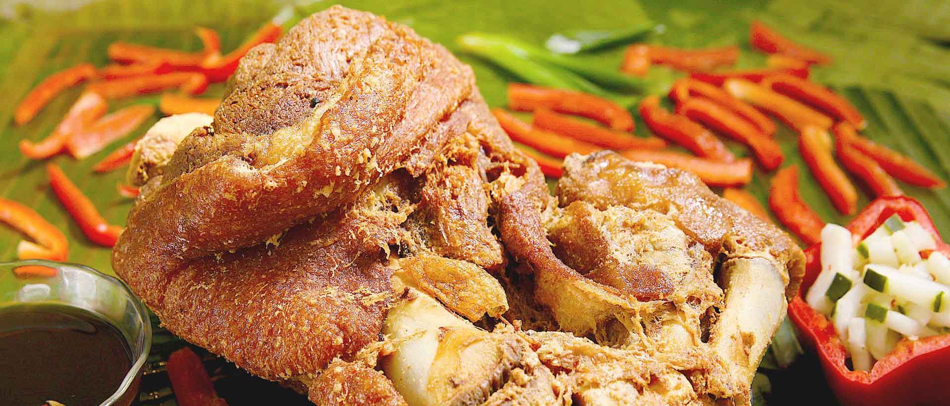 Golden crispy pata, deep-fried pork leg served at House of Grill Granada Hills
