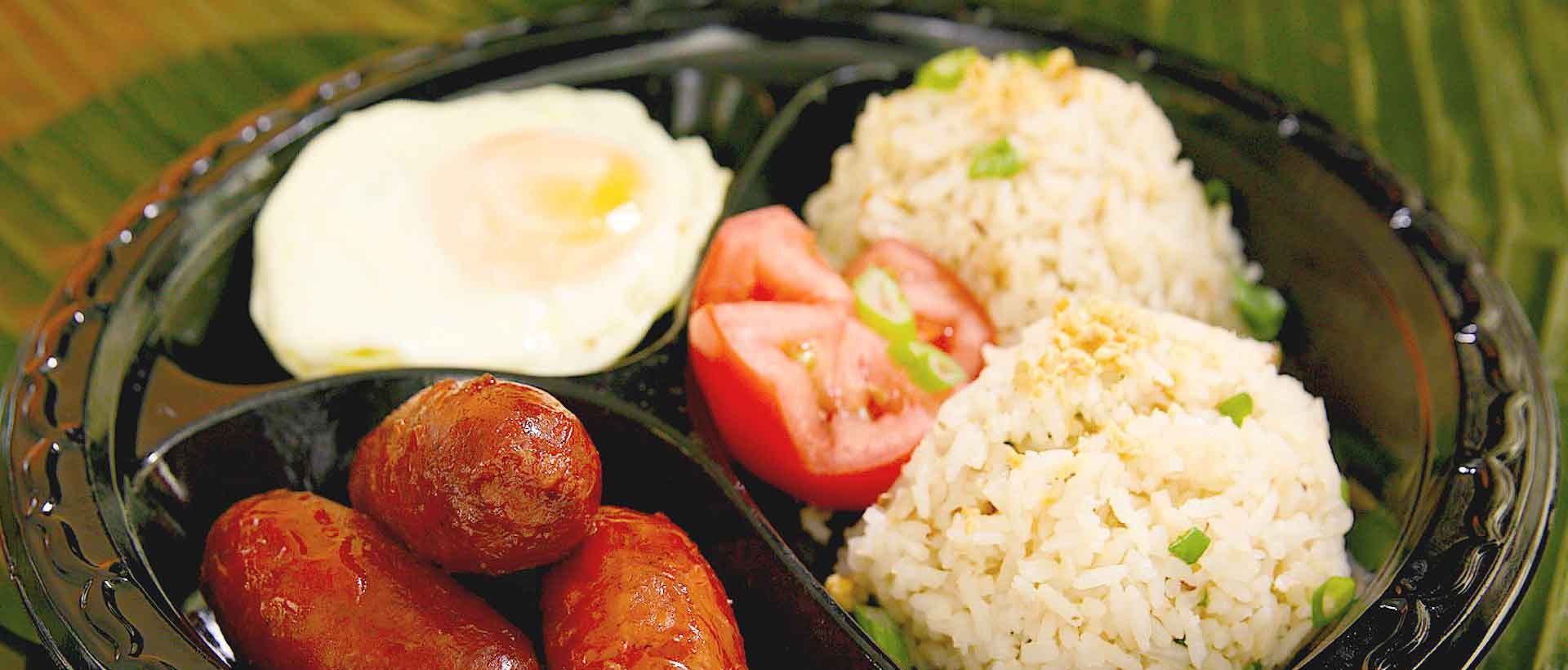 Longsilog breakfast with Filipino longganisa sausage, garlic rice and egg