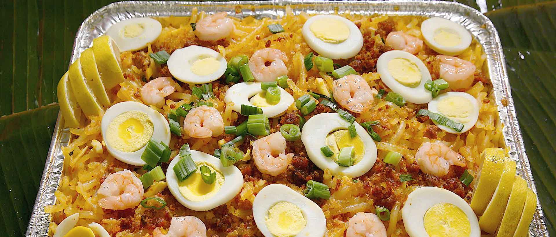 Pancit malabon thick rice noodles topped with shrimp and egg