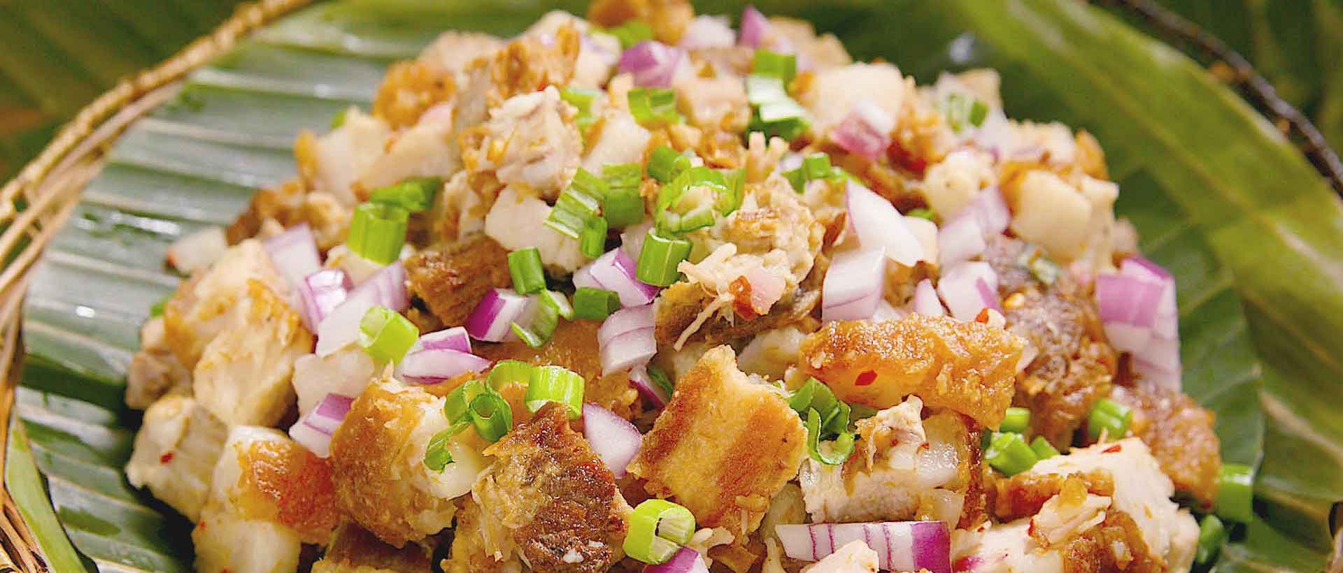 Sizzling Filipino pork sisig plated at House of Grill