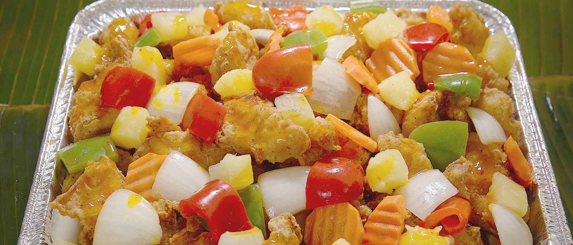 Filipino sweet and sour fish with peppers and pineapple